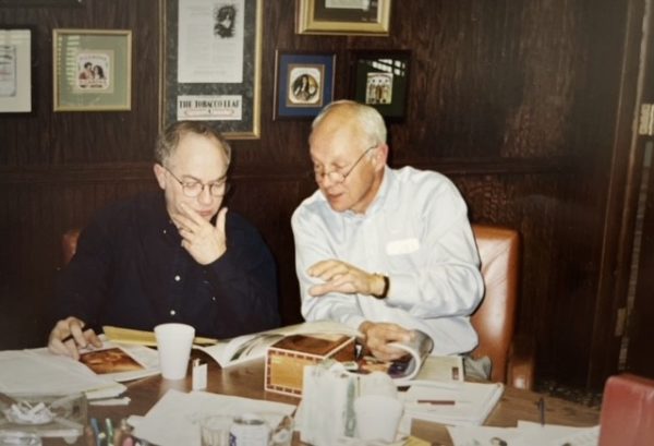 Two men discussing business in an office